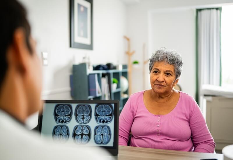 A neurologist with a patient